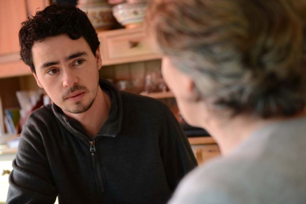 Different coloured sticky notes stuck to a notepad, featuring the words 