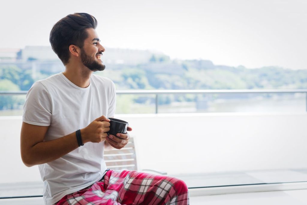 Illustrative image of a person reading while their phone is set aside in a basket.