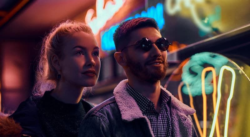 Illustrative image of two people laughing and having a good time together.