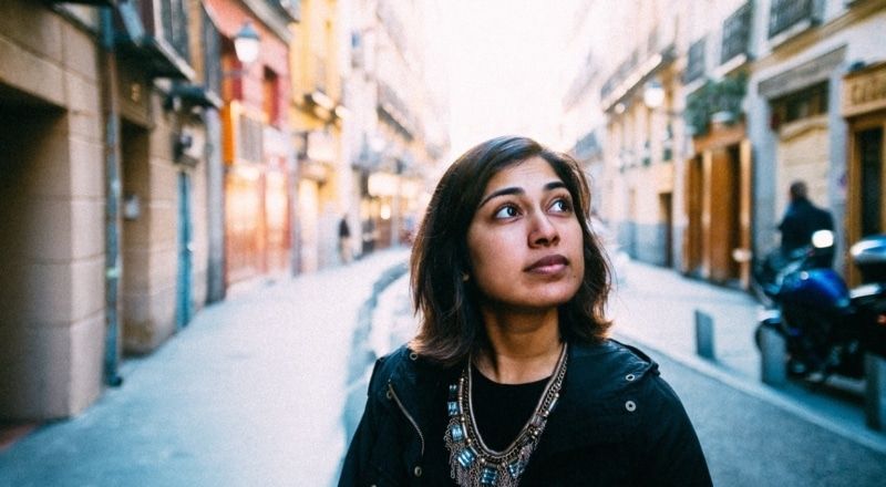 Illustrative photo of a young person walking in an empty street.