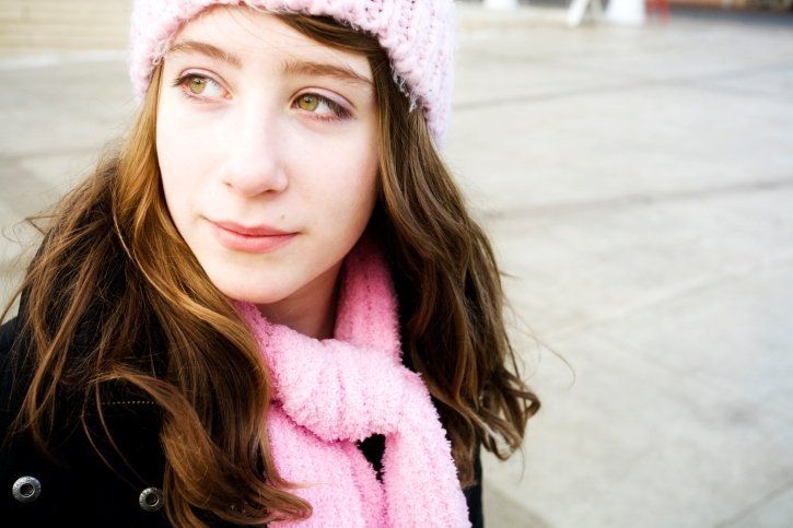 Illustrative image of a person looking off to the side against a grey industrial background.