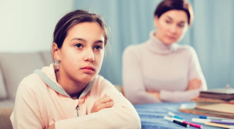 Illustrative image of people's hands exchanging ideas and holding speech bubbles.