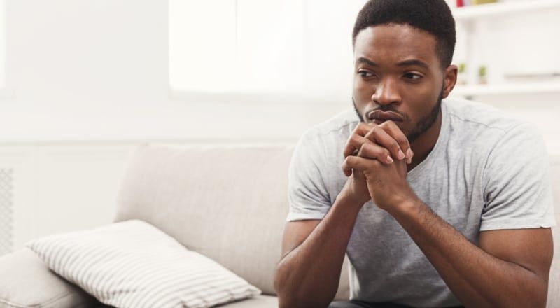 Illustration of an upset person propping their head up with their hand.