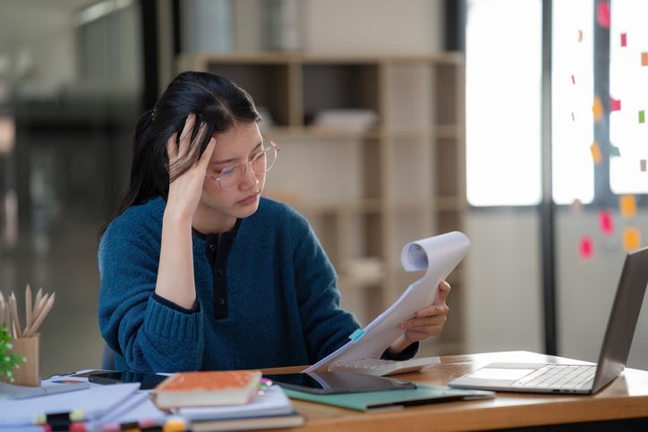 Illustration of a cartoon figure shrugging and looking confused, with question marks above their head.