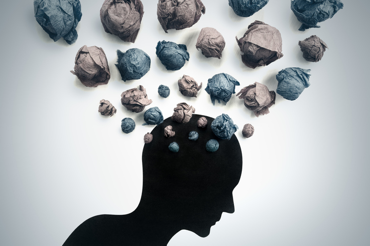 Illustration of a silhouette with lots of abstract shapes representing thoughts in a cloud above the head.