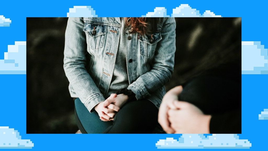 Illustrative image of a seated person's torso with hands clasped.