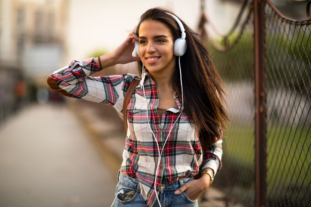 Thumbnail image of a person standing against a black background next to the words: