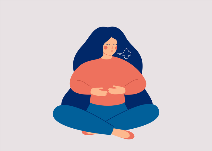 Illustrative image of a person sitting in the lotus position and doing a breathing exercise.