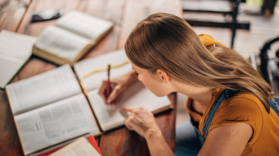 person studying and writing