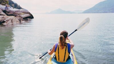 What is the difference between kayaking and canoeing?