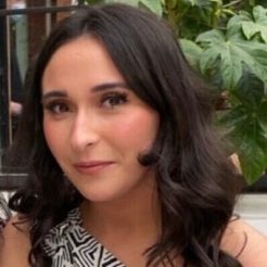 Shannen smiles at camera.