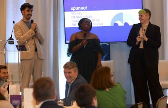 Three people presenting standing in front of a spunout presentation - one is Joseph Morning, spunout staff memeber