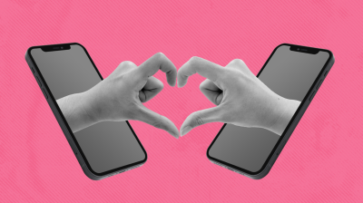 hands coming out of two phones making a heart