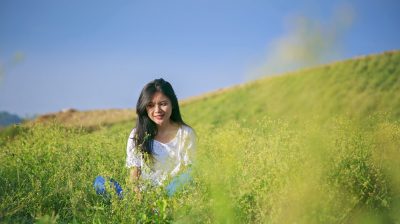 Irish teenager sitting in a meadow