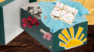 Green memory box filled with a sentimental picture, baby blanket and letter from loved ones