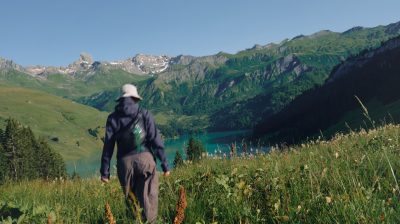 Girl standing outdoors in a scenic landscape