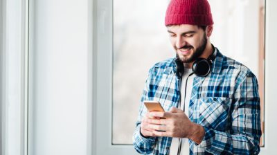 guy using a phone to listen music
