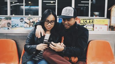 A-couple-looking-at-a-phone