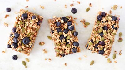 Superfood breakfast bars, above view on marble background