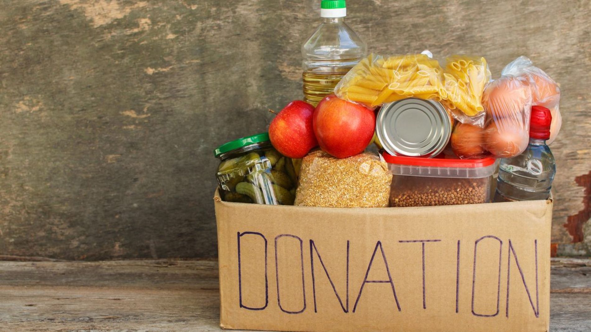 A donation box filled with food
