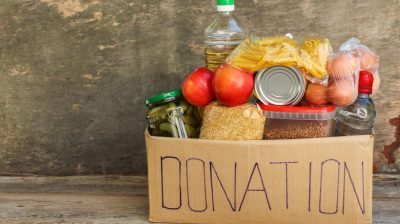 A donation box filled with food