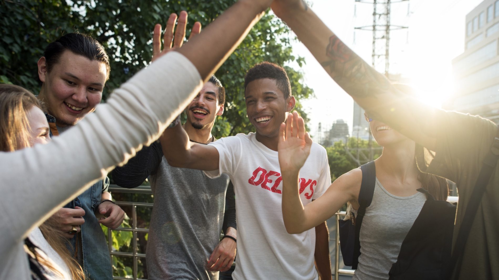 Friends giving high fives