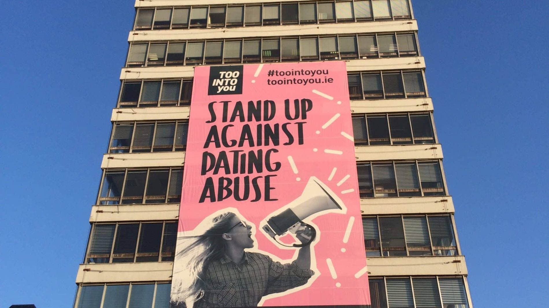 Women's aid poster on side of Liberty Hall