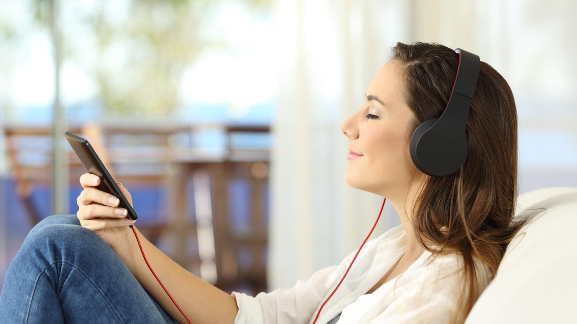 Profile of a woman relaxing listening music