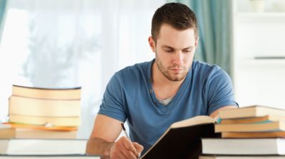 Man-studying-books