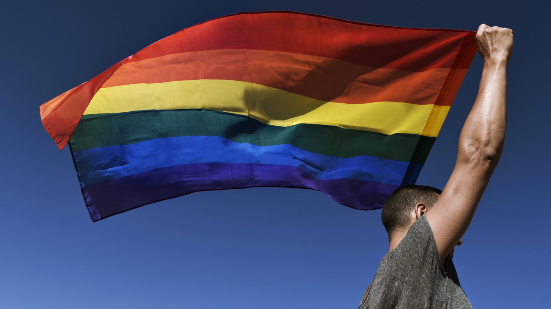 man with a rainbow flag