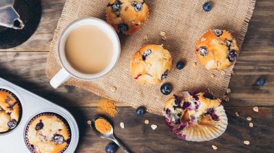 Blueberry muffins breakfast on a rustic table