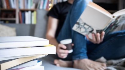 Reading-a-book-on-the-couch-1zkYbR