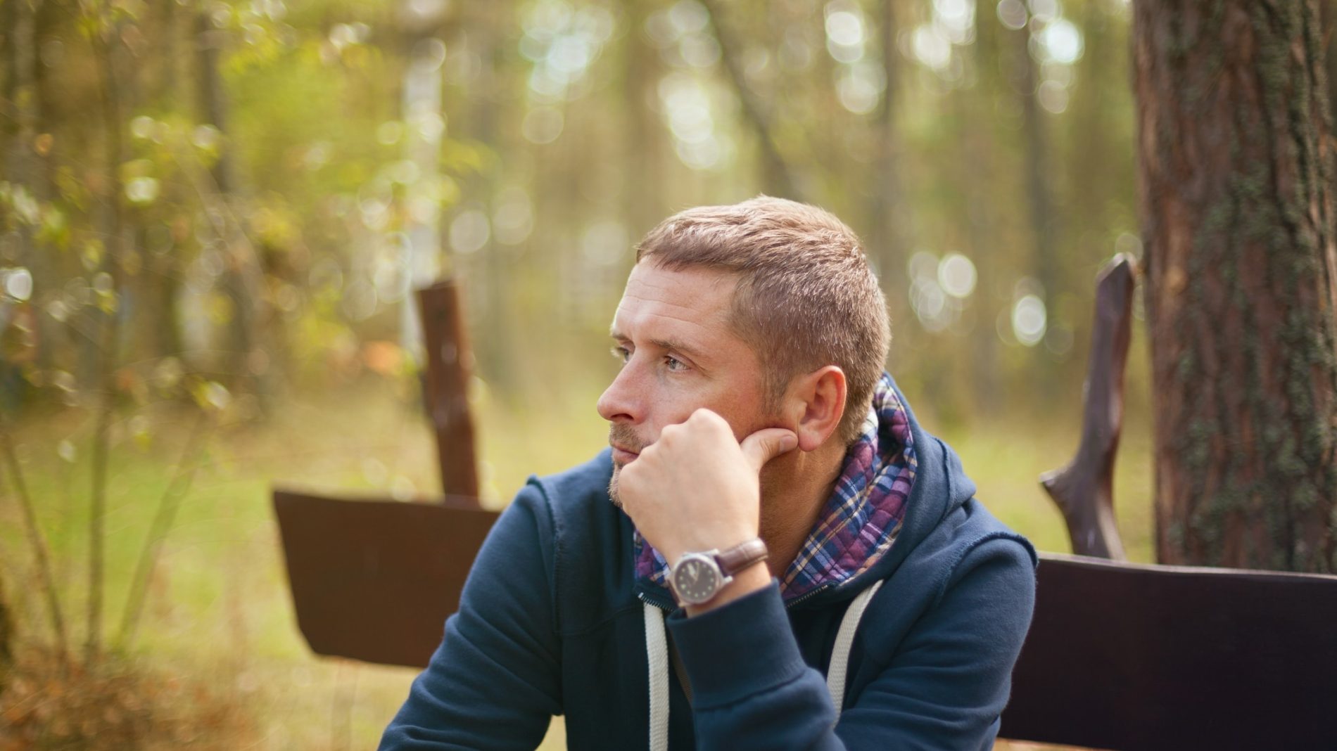 a young man looking pensive