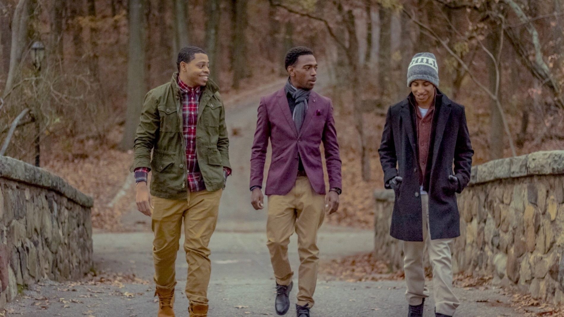 Three friends walking outside together