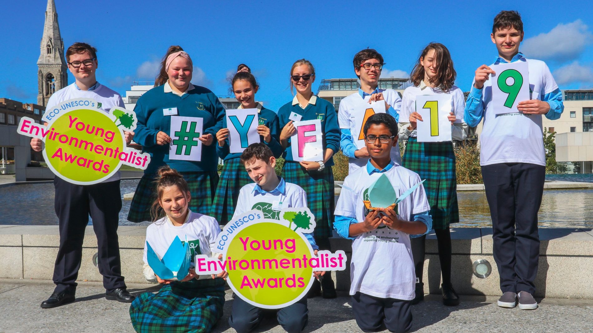 Official YEA 2019 photo - students holding signs