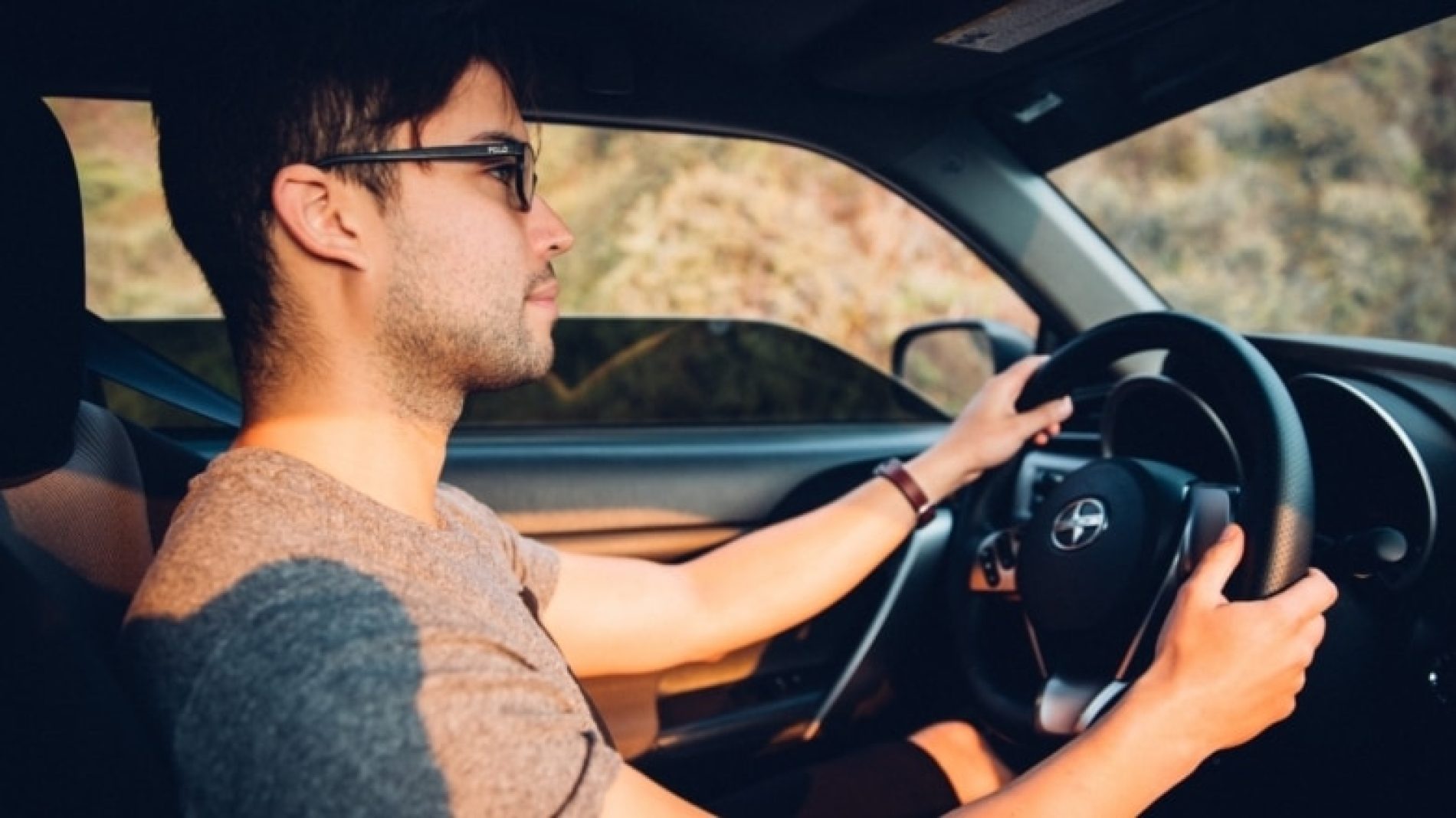 Young-man-driving-a-car