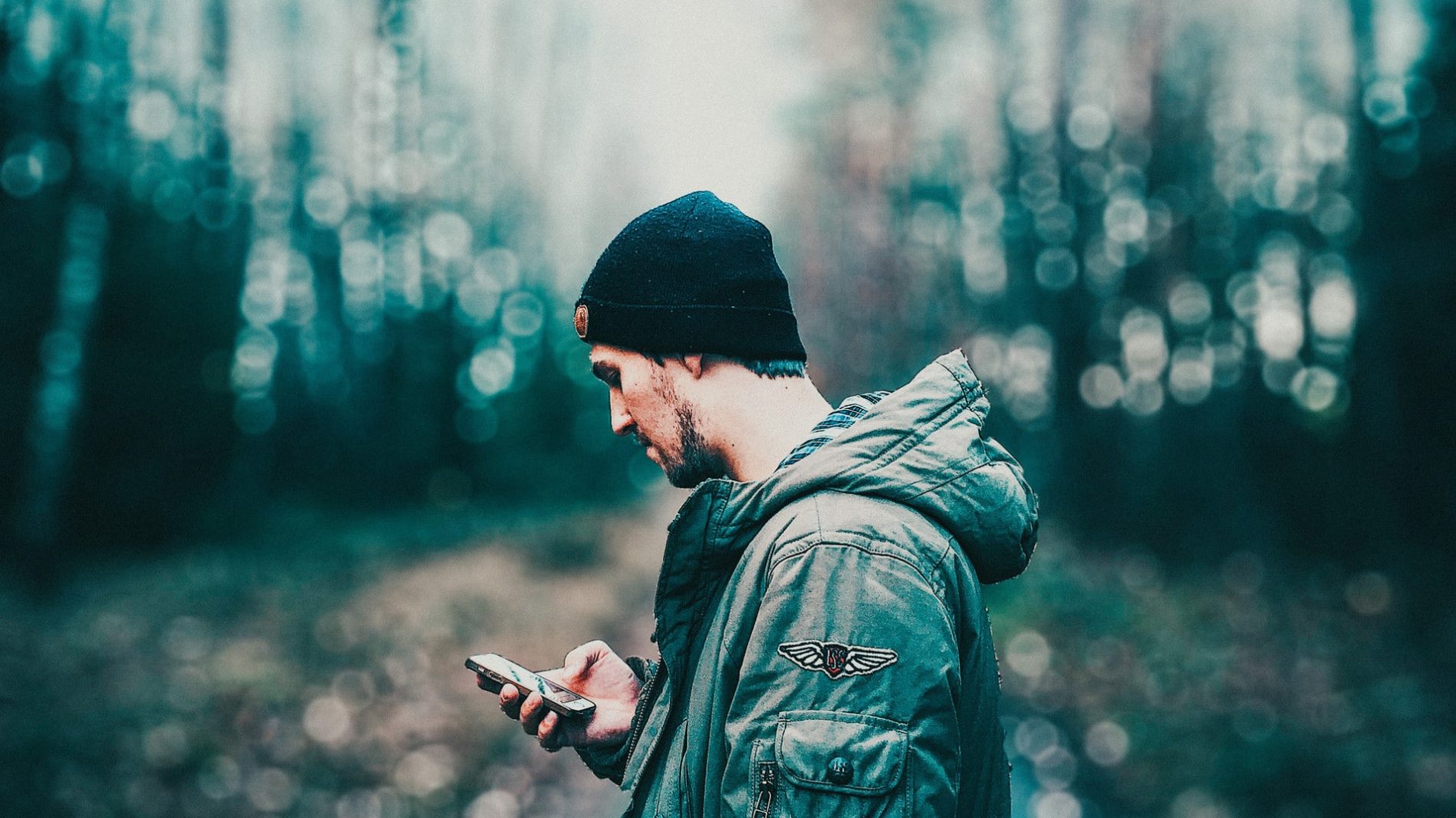 Young man looking at social media on his phone