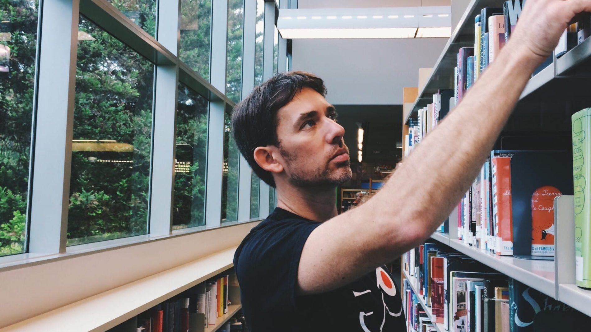 Young-person-in-college-library-to-study