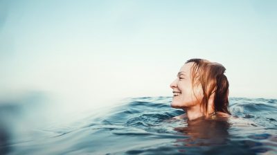 Young person swimming in the sea
