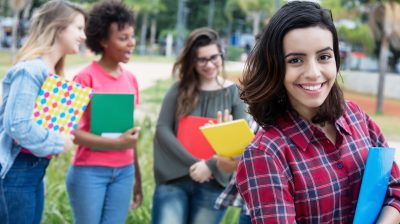 Hispanic female student with group of international students