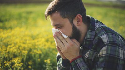 Hipster man Sneezing
