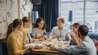 A group of people sitting around a table