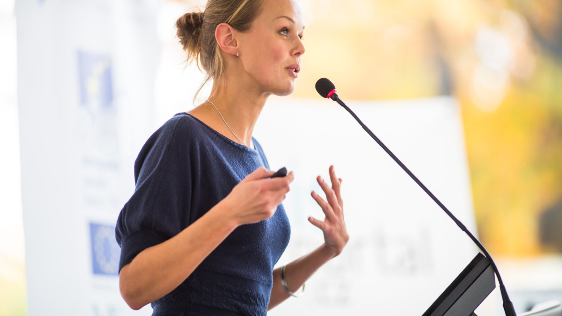 Pretty, young business woman giving a presentation