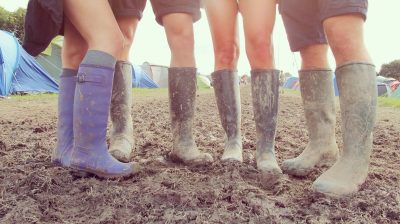 people wearing wellies at a festival