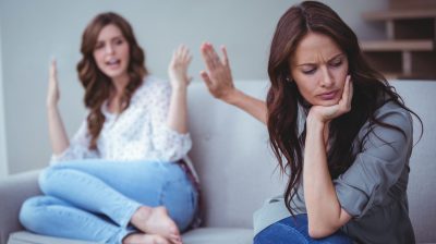 Two female friends arguing with each other