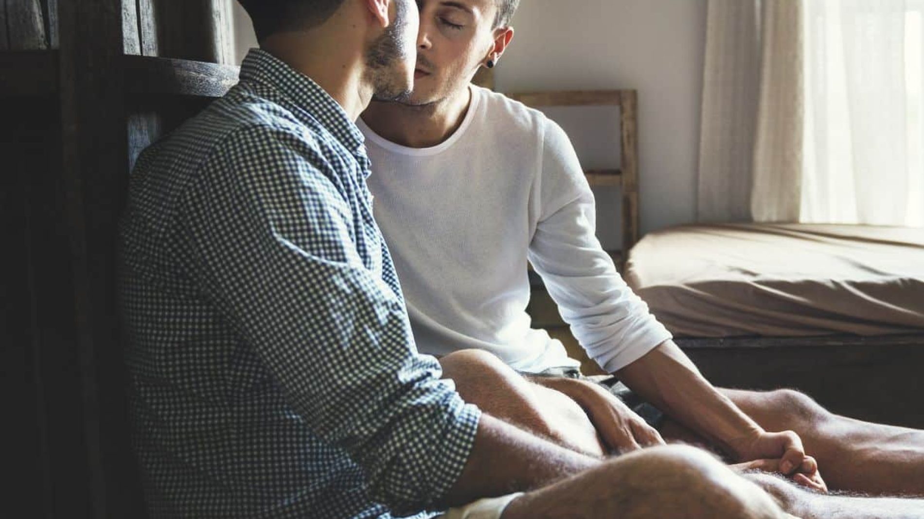Gay couple kissing