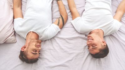 gay-men-smiling-in-bed