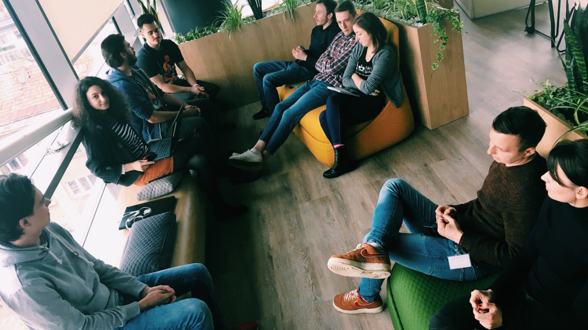 Photo of a group of young people sitting in a waiting area