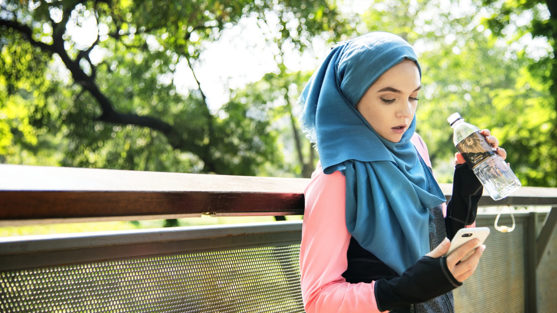 Islamic woman resting and drinking water