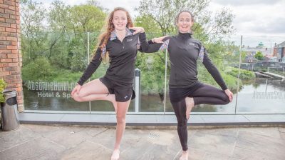2 girls doing yoga